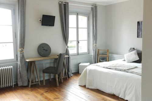 Ένα ή περισσότερα κρεβάτια σε δωμάτιο στο Le Domaine d'Euclide