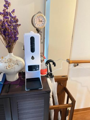 a hair dryer sitting on top of a wooden table at 瓦町駅•home 101 in Takamatsu