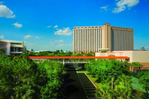 a bridge over a river in front of a building at Rosen Centre Hotel Orlando Convention Center in Orlando