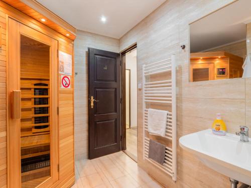 a bathroom with a sink and a mirror at Holiday Home Jelení kout by Interhome in Smržovka