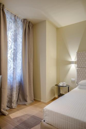 Hotel Borgo Imperoにあるベッド