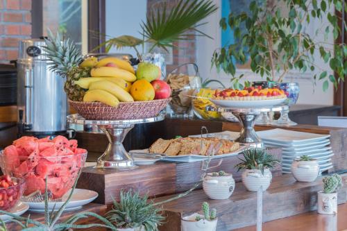 a buffet of fruits and vegetables on a table at Hotel y Cabañas Campanario in La Serena