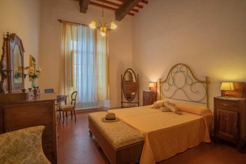 Ένα ή περισσότερα κρεβάτια σε δωμάτιο στο Agriturismo La Ripolina