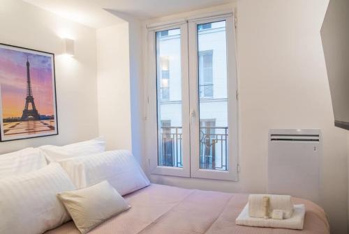 Postel nebo postele na pokoji v ubytování T2 à Paris Centre Smart TV, Nespresso, WIFI