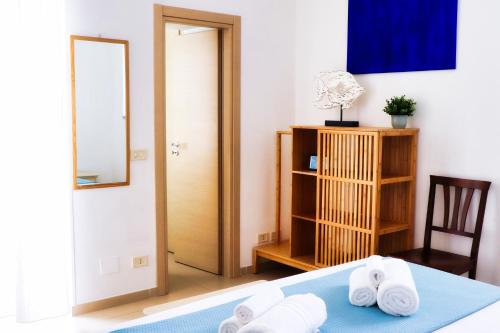Кровать или кровати в номере Saltwater con parcheggio privato