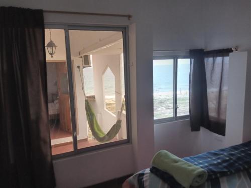 Una cama o camas en una habitación de Hospedaje Algarrobo Machalilla