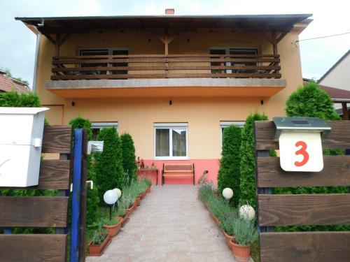a house with a fence and a walkway at Éden II. in Miskolctapolca