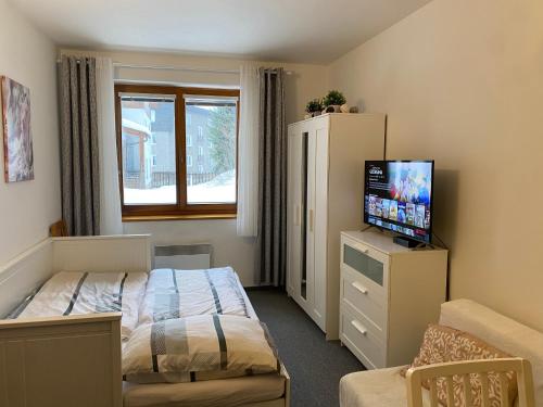 Postel nebo postele na pokoji v ubytování Horský apartmán ROKY - Krkonoše