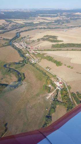 an aerial view of a river and fields from an airplane at Gîte du Domaine de la Forge in Boncourt-sur-Meuse