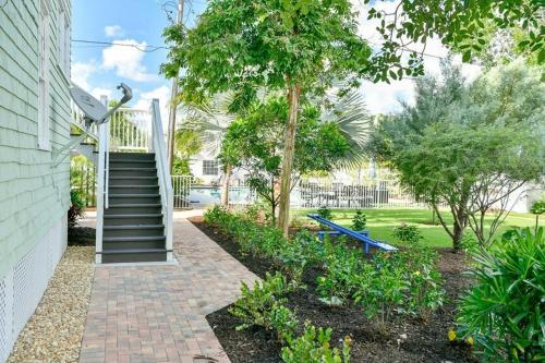 a house with a staircase leading to a yard at Old Colorado Inn in Stuart