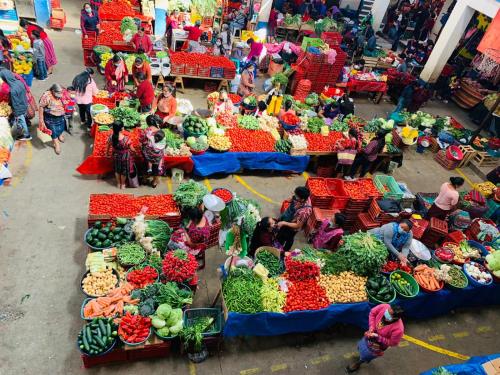 an overhead view of a farmers market with vegetables at Hotel Museo Mayan Inn in Chichicastenango