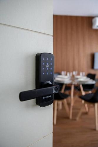 a remote control on a wall next to a table at Sweet Dreams I in Junín