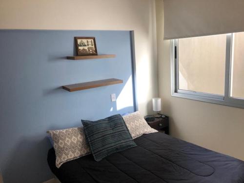 מיטה או מיטות בחדר ב-Cozy Apartment in Nuñez