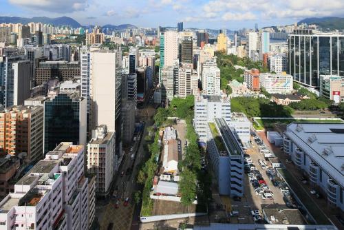 an aerial view of a city with tall buildings at B P International in Hong Kong
