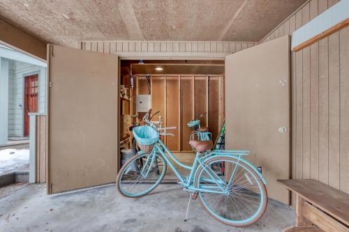 a blue bike is parked in a garage at Forest Hideaway in Sunriver