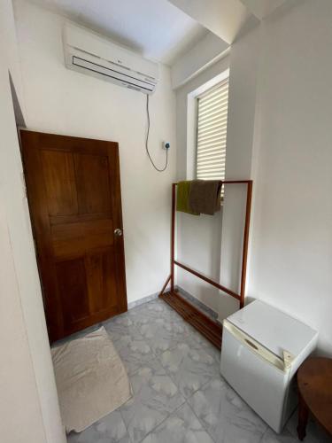 an empty room with a door and a mirror at Lake View Villa - Tangalle in Tangalle