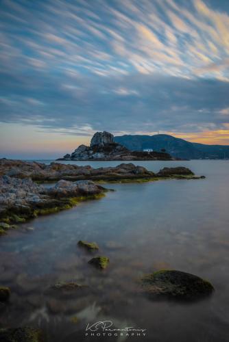 an island in the middle of a body of water at Paradise in Kefalos