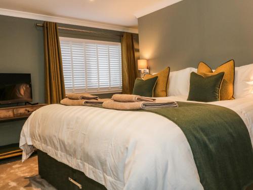 Katil atau katil-katil dalam bilik di Feus Holiday Cottage