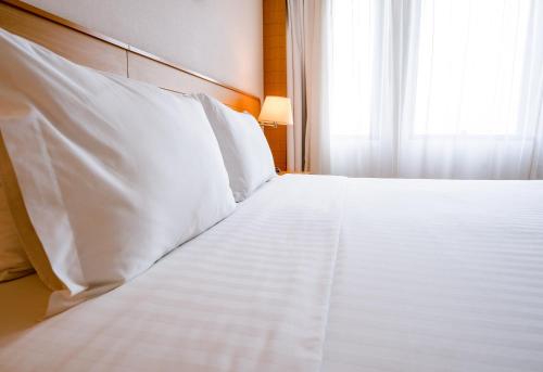 Postelja oz. postelje v sobi nastanitve Holiday Inn Parque Anhembi, an IHG Hotel