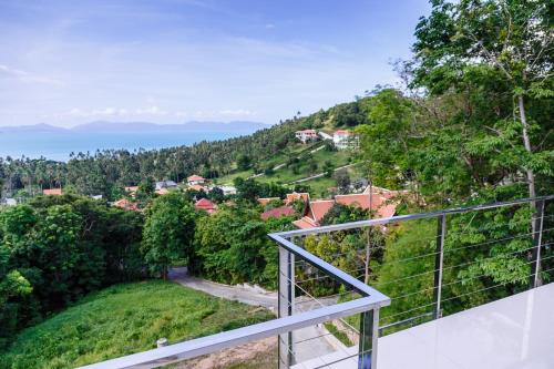 an ocean view from the balcony of a house at villa Siam View Samui in Ban Bang Po