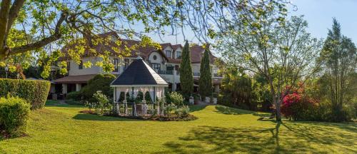 a large house with a gazebo in a yard at Oliver`s in White River