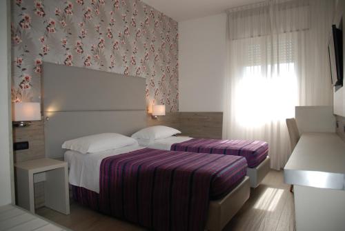 Katil atau katil-katil dalam bilik di Hotel Lugano Torretta