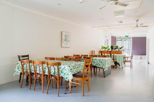 a dining room with a table and chairs at Tarcutta Retreat in Tarcutta