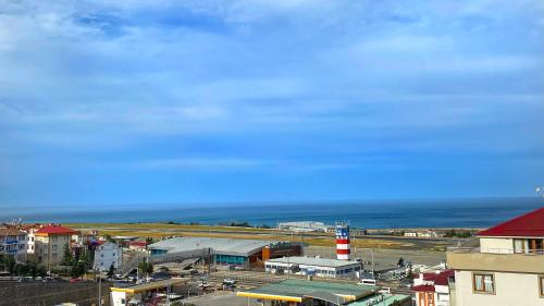a view of a city with the ocean in the background at Heaven Suite Hotel in Trabzon