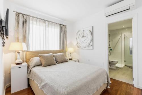 Ένα ή περισσότερα κρεβάτια σε δωμάτιο στο Los Naranjos 7
