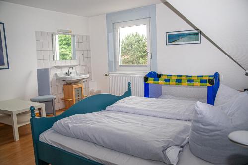 Postel nebo postele na pokoji v ubytování Ferienhaus Rike