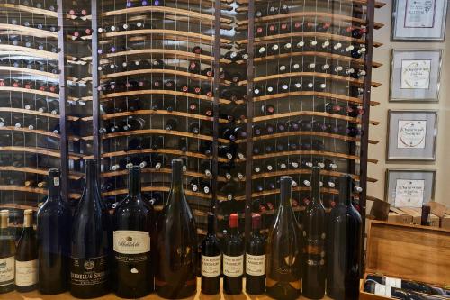 a wall of wine bottles in a wine cellar at The Devon Valley Hotel in Stellenbosch