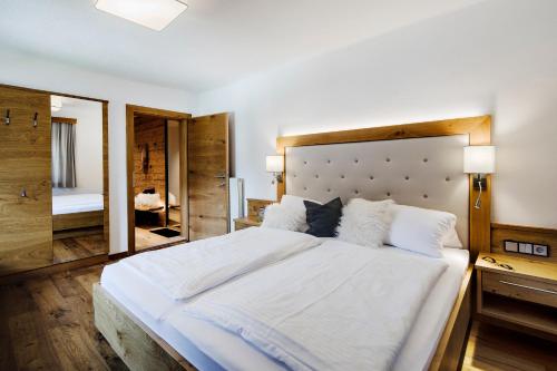 Ένα ή περισσότερα κρεβάτια σε δωμάτιο στο Thomanhof Chalet-Appartement