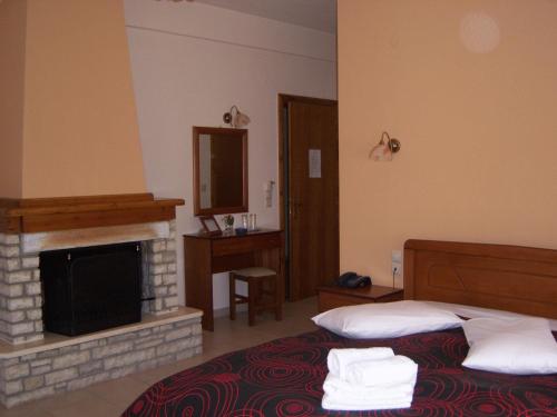 Postel nebo postele na pokoji v ubytování Hotel Ilianna