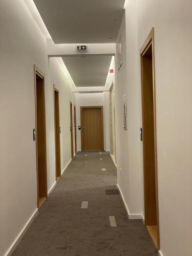 a hallway of a building with a long corridor at Apartmani G8 in Pale