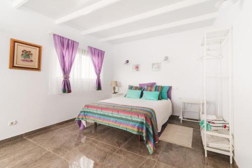 Postel nebo postele na pokoji v ubytování Home2Book Comfy Duplex La Isleta, BBQ & Wifi