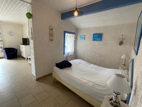 En eller flere senger på et rom på Holiday house close to the ocean in Lacanau-Ocean