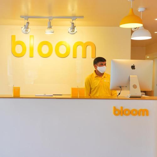 a man wearing a mask in front of a laptop at Bloom - Golf Course Road in Gurgaon