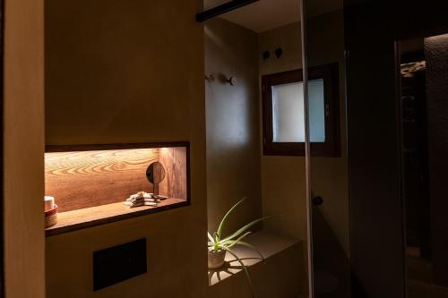 a bathroom with a shower with a glass door at Can Barrina in Montseny