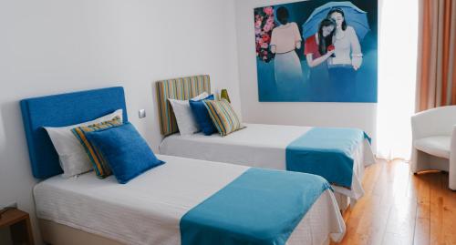 Quinta de Fiães tesisinde bir odada yatak veya yataklar