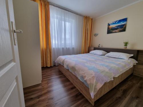 Ένα ή περισσότερα κρεβάτια σε δωμάτιο στο 11 RESIDENCE APARTMENT