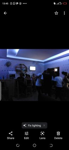a picture of a room with people in it at Kicec bar and guest house airport in Dar es Salaam
