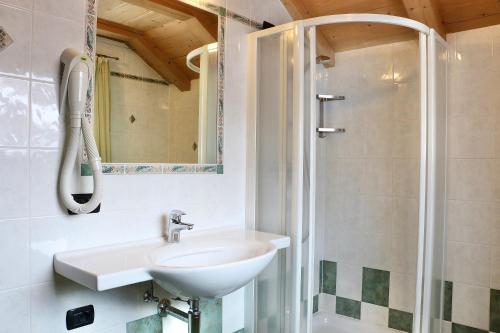 a bathroom with a sink and a shower at Casa Peri in Livigno