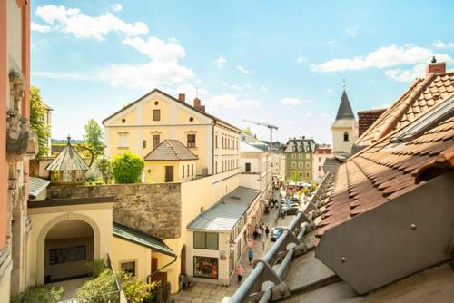 an overhead view of a city with buildings and a street at Am Paulusbogen in Passau