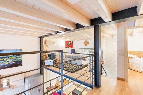 a room with a spiral staircase in a house at Loft di Design Porta Romana/Corso Lodi in Milan