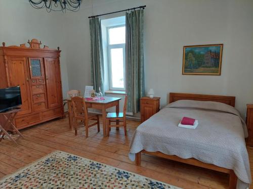 Postel nebo postele na pokoji v ubytování Hotel Grasu Pils