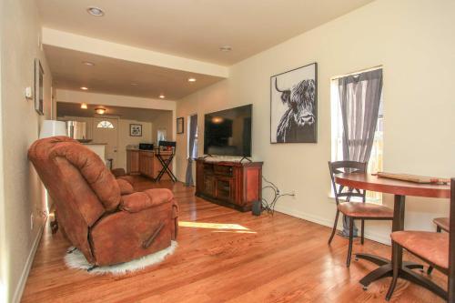 a living room with a chair and a table at Downtown Home with Grill 5 Mi to Garden of the Gods in Colorado Springs