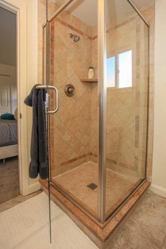 a shower with a glass door in a bathroom at Downtown Home with Grill 5 Mi to Garden of the Gods in Colorado Springs