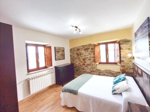 Katil atau katil-katil dalam bilik di Apartamentos Navalin