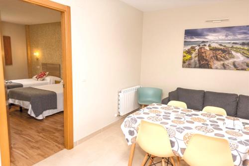 Katil atau katil-katil dalam bilik di Apartamentos Navalin