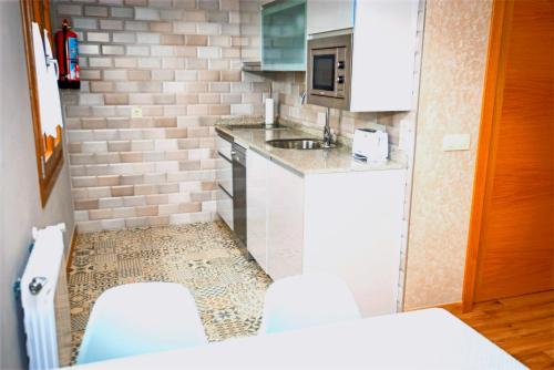 Dapur atau dapur kecil di Apartamentos Navalin